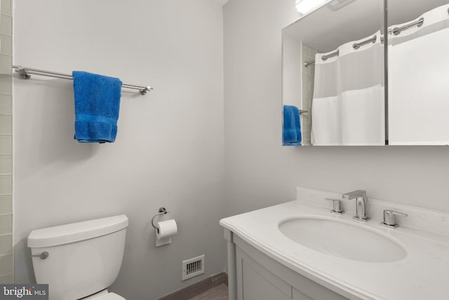 13316 Dauphine St, Silver Spring, MD 20906 - bathroom featuring toilet, vanity, and curtained shower