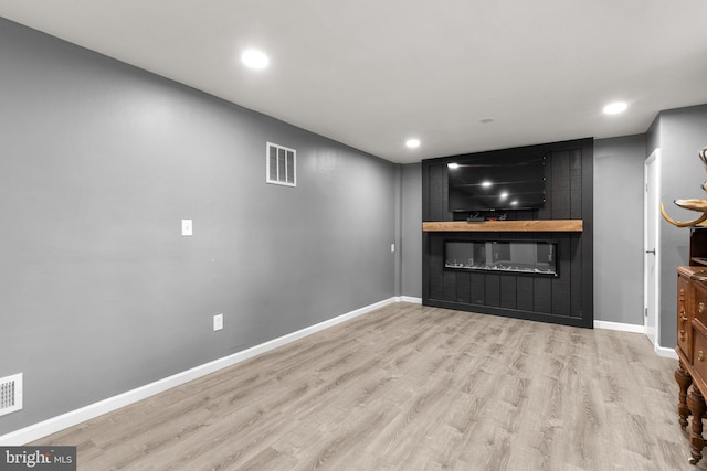 13316 Dauphine St, Silver Spring, MD 20906 - unfurnished living room featuring a fireplace, wood finished floors, baseboards, and recessed lighting