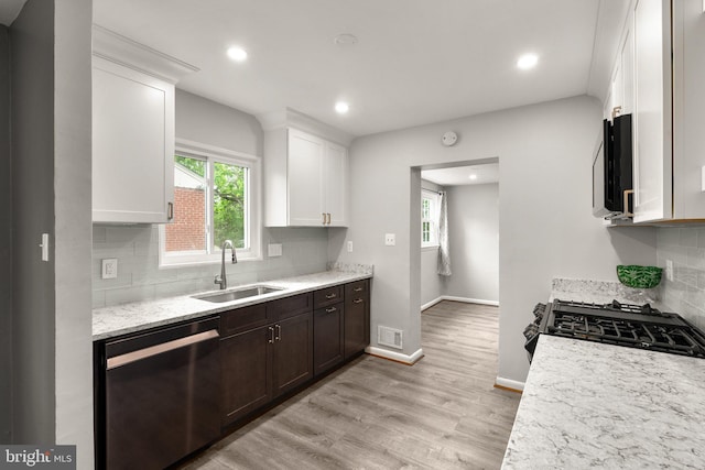 13316 Dauphine St, Silver Spring, MD 20906 - kitchen with dishwasher, a sink, range with gas cooktop, white cabinets, and light wood finished floors