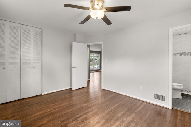 13316 Dauphine St, Silver Spring, MD 20906 - unfurnished bedroom featuring wood finished floors, baseboards, ensuite bath, and a closet