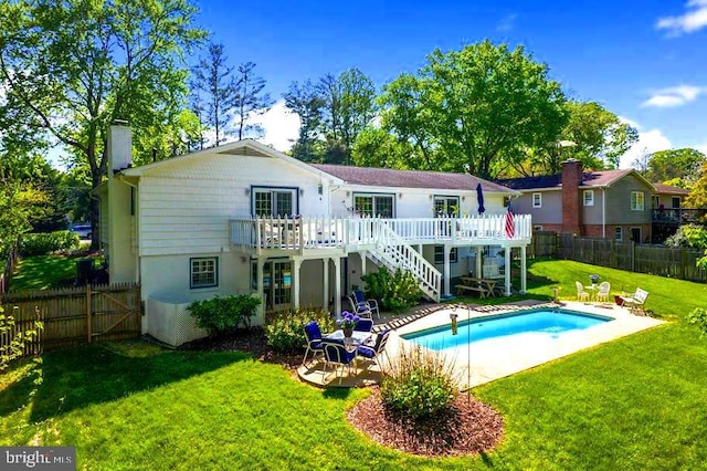 10728 Zion Dr, Fairfax, VA 22032 - rear view of property with a deck, a fenced backyard, a chimney, stairs, and a yard