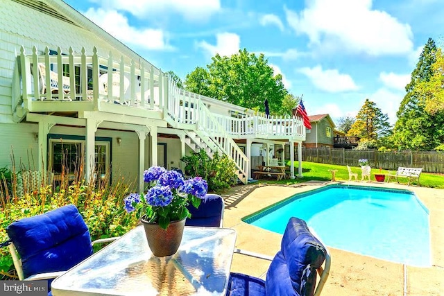 10728 Zion Dr, Fairfax, VA 22032 - view of swimming pool with a wooden deck, fence, a fenced in pool, a patio, and stairs