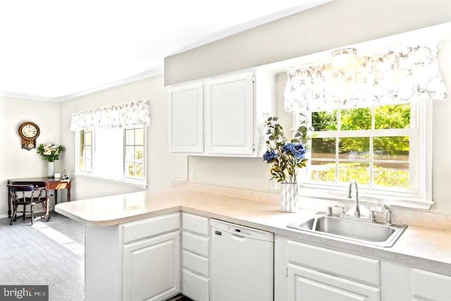 10728 Zion Dr, Fairfax, VA 22032 - kitchen featuring a peninsula, white dishwasher, light countertops, white cabinets, and a sink