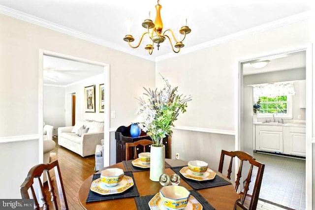 10728 Zion Dr, Fairfax, VA 22032 - dining space with an inviting chandelier, ornamental molding, and hardwood / wood-style floors