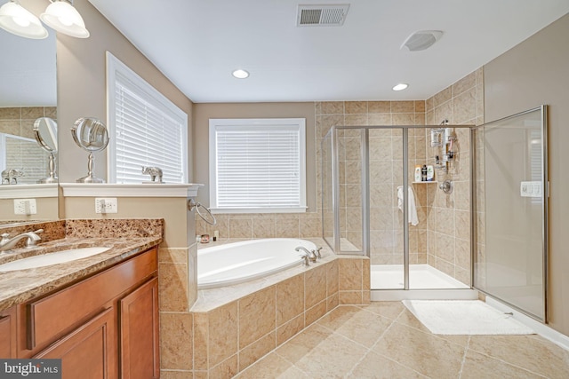 bathroom with tile patterned flooring, visible vents, a garden tub, and a stall shower