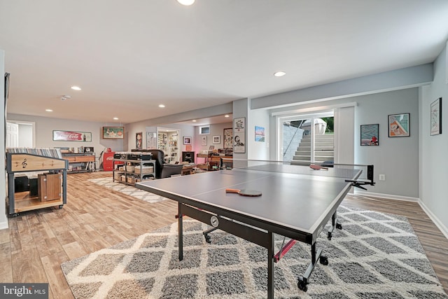 game room featuring recessed lighting, light wood-style flooring, and baseboards