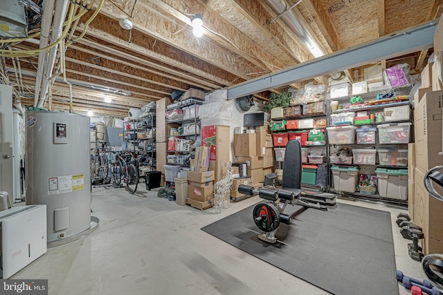 unfinished basement featuring water heater