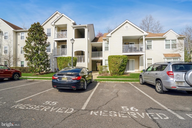view of property featuring uncovered parking