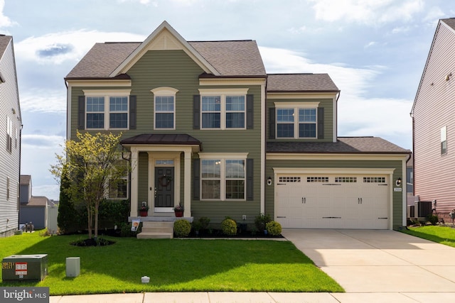 view of front of house featuring a garage, central AC, driveway, and a front lawn