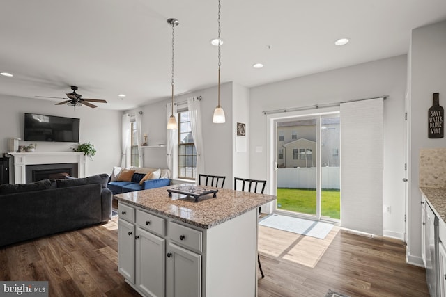 kitchen featuring recessed lighting, ceiling fan, dark wood-style flooring, and a wealth of natural light