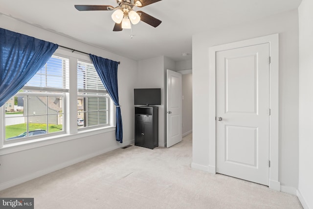 unfurnished bedroom with baseboards and carpet