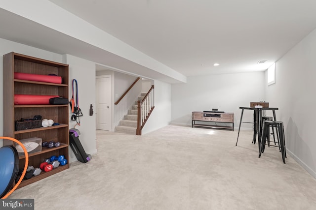 rec room with carpet floors, baseboards, and visible vents