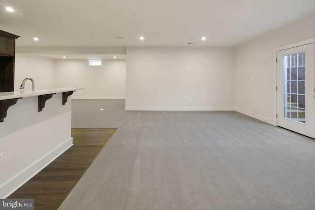 interior space featuring carpet floors, recessed lighting, and baseboards