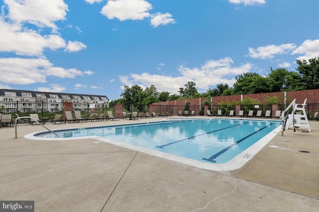 12521 Honey Locust Way, Beltsville, MD 20705 - community pool with fence and a patio area