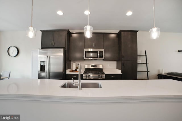 12521 Honey Locust Way, Beltsville, MD 20705 - kitchen with appliances with stainless steel finishes, light countertops, pendant lighting, a sink, and recessed lighting