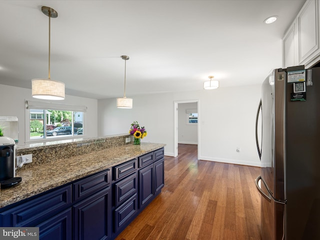 1904 N Amelia St, Sterling, VA 20164 - kitchen with freestanding refrigerator, blue cabinets, wood finished floors, white cabinetry, and recessed lighting