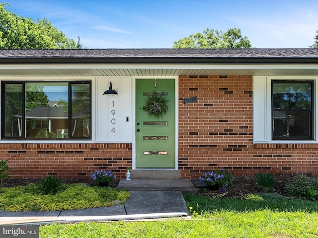 1904 N Amelia St, Sterling, VA 20164 - view of exterior entry featuring brick siding and a porch