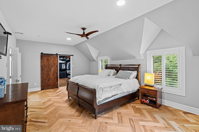 bedroom featuring a barn door, recessed lighting, baseboards, lofted ceiling, and visible vents
