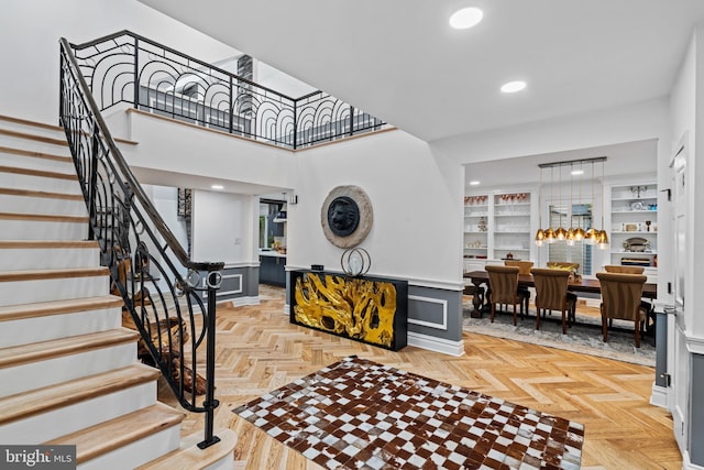 entryway featuring stairs and recessed lighting