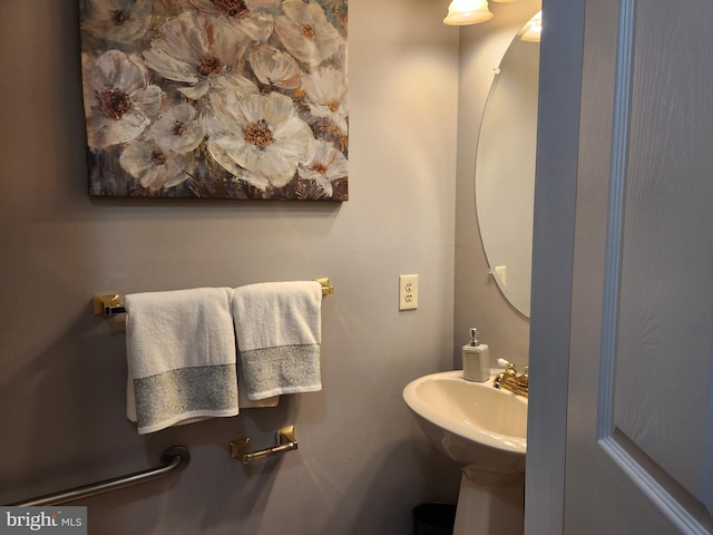 half bath featuring a sink