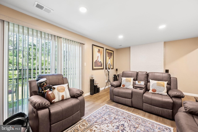 living room with a wealth of natural light, baseboards, and visible vents