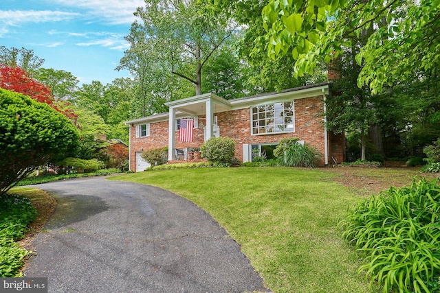 6368 Waterway Dr, Falls Church, VA 22044 - view of front of home with brick siding, a front lawn, and driveway