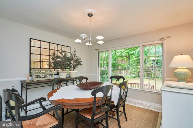 6368 Waterway Dr, Falls Church, VA 22044 - dining area with a chandelier, tile patterned floors, and baseboards