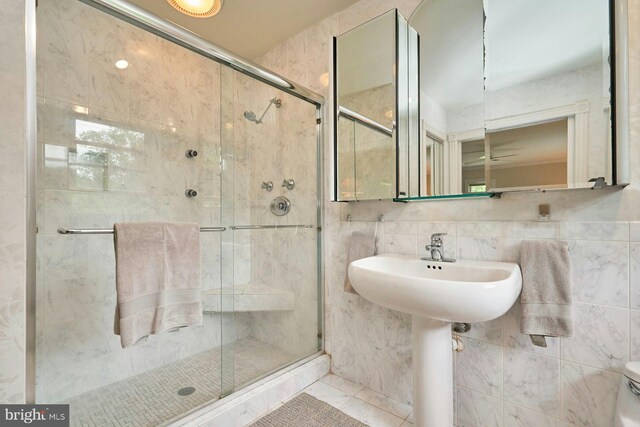 6368 Waterway Dr, Falls Church, VA 22044 - full bathroom featuring a stall shower, tile walls, and toilet