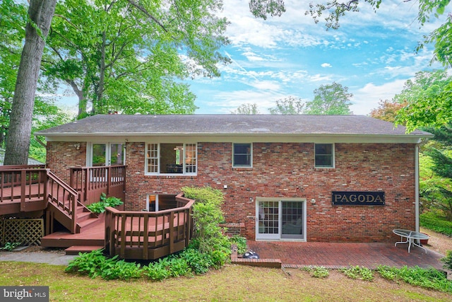 6368 Waterway Dr, Falls Church, VA 22044 - back of house with a wooden deck, brick siding, and a patio
