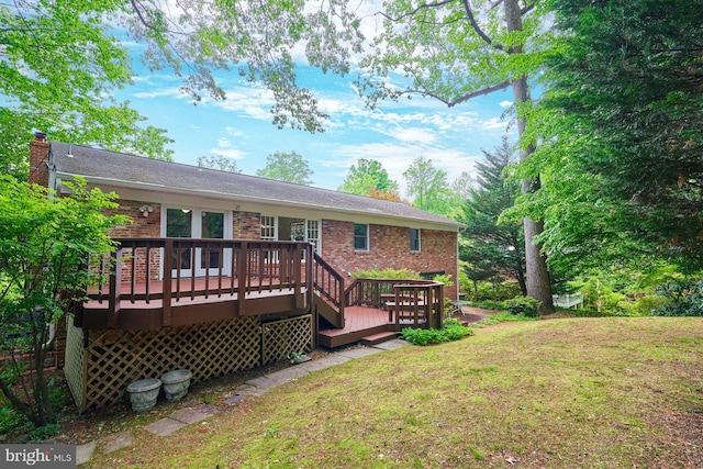 6368 Waterway Dr, Falls Church, VA 22044 - back of house with a deck, a yard, brick siding, and a chimney