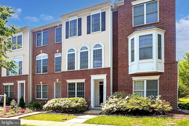 view of property with brick siding