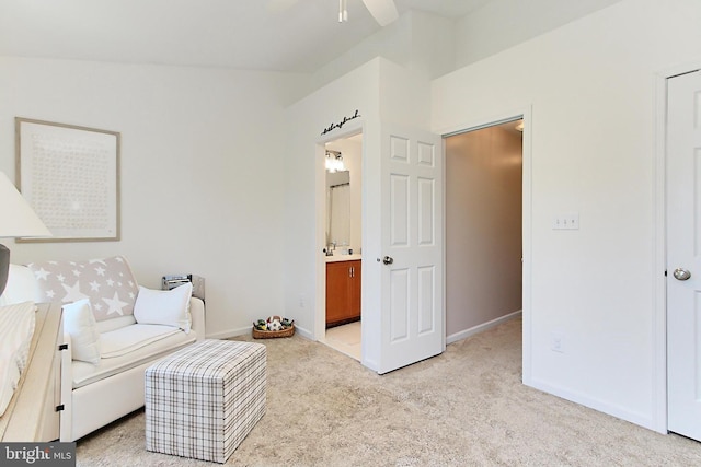 sitting room with baseboards, a ceiling fan, and light colored carpet