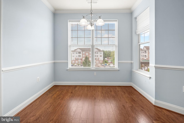 1604 Martha Ct Unit 404, Bel Air, MD 21015 - unfurnished dining area with a chandelier, wood finished floors, crown molding, and baseboards