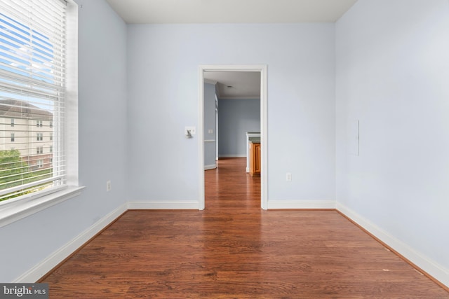 1604 Martha Ct Unit 404, Bel Air, MD 21015 - spare room featuring plenty of natural light, wood finished floors, and baseboards