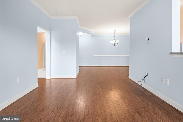 1604 Martha Ct Unit 404, Bel Air, MD 21015 - unfurnished room featuring a chandelier, ornamental molding, wood finished floors, baseboards, and a smoke detector
