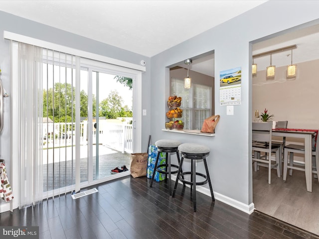 1710 Dennis Ct, District Heights, MD 20747 - dining area featuring baseboards, wood finished floors, and visible vents