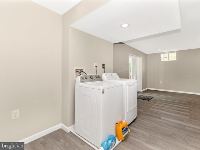 1710 Dennis Ct, District Heights, MD 20747 - washroom with light wood-style floors, baseboards, laundry area, and washer and clothes dryer