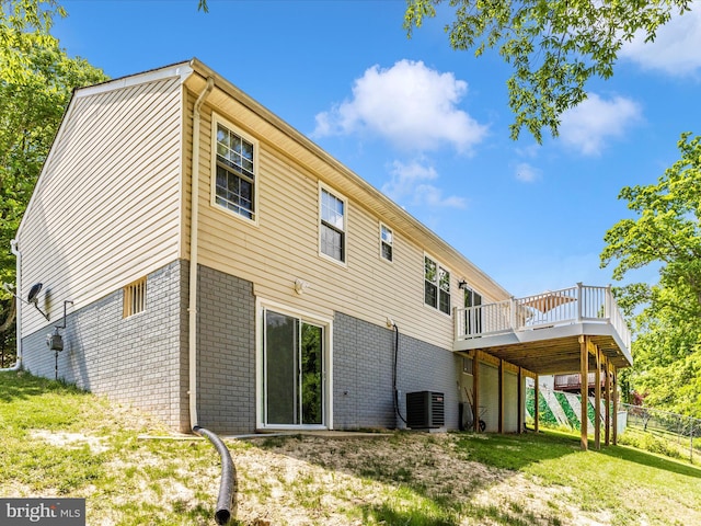 1710 Dennis Ct, District Heights, MD 20747 - rear view of house with fence, brick siding, a deck, central air condition unit, and a lawn
