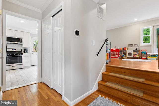 1612 Belvedere Blvd, Silver Spring, MD 20902 - staircase featuring crown molding, wood finished floors, healthy amount of natural light, recessed lighting, and baseboards