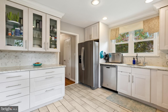 1612 Belvedere Blvd, Silver Spring, MD 20902 - kitchen with stainless steel appliances, a sink, decorative backsplash, recessed lighting, and light wood-style flooring