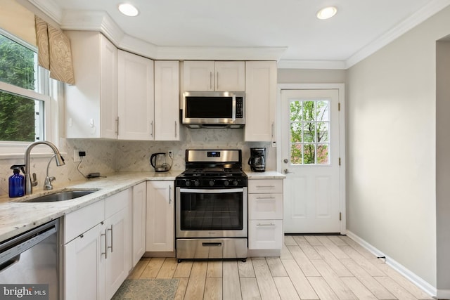 1612 Belvedere Blvd, Silver Spring, MD 20902 - kitchen with appliances with stainless steel finishes, a sink, backsplash, recessed lighting, and crown molding