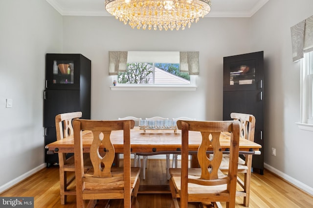 1612 Belvedere Blvd, Silver Spring, MD 20902 - dining space featuring a chandelier, ornamental molding, light wood-style flooring, and baseboards