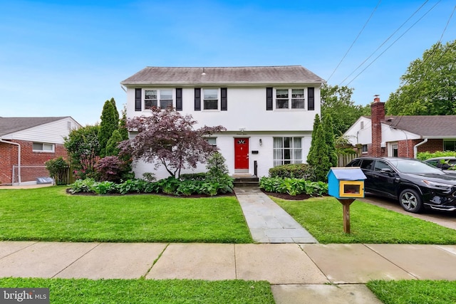 1612 Belvedere Blvd, Silver Spring, MD 20902 - colonial-style house with stucco siding and a front lawn