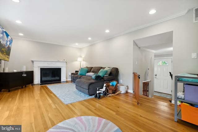 1612 Belvedere Blvd, Silver Spring, MD 20902 - living room featuring wood finished floors, recessed lighting, ornamental molding, baseboards, and a fireplace with flush hearth