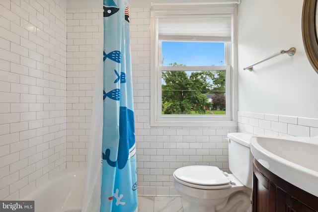 1612 Belvedere Blvd, Silver Spring, MD 20902 - full bath featuring tile walls, vanity, marble finish floors, toilet, and shower / bath combo