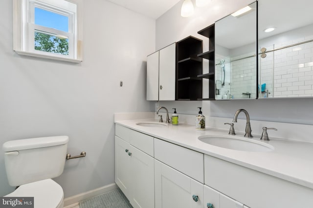 1612 Belvedere Blvd, Silver Spring, MD 20902 - bathroom featuring double vanity, baseboards, toilet, and a tile shower