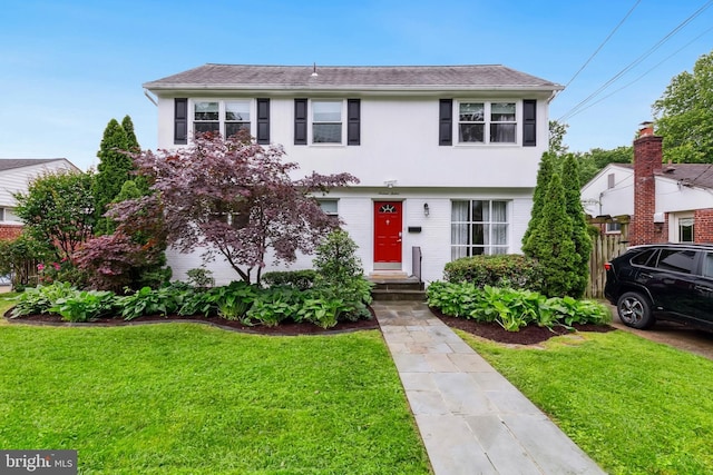 1612 Belvedere Blvd, Silver Spring, MD 20902 - colonial inspired home featuring a front yard and stucco siding
