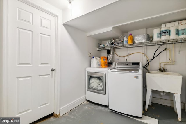 1612 Belvedere Blvd, Silver Spring, MD 20902 - laundry room with washer and dryer and baseboards