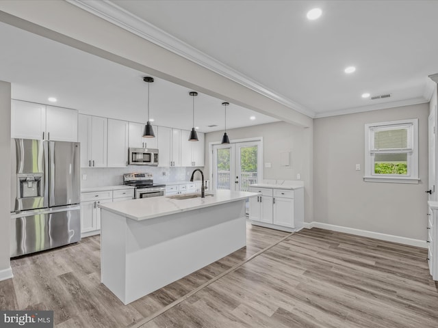 kitchen with crown molding, recessed lighting, appliances with stainless steel finishes, and a sink