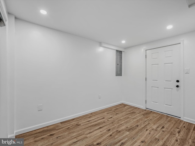 entrance foyer featuring recessed lighting, baseboards, wood finished floors, and electric panel